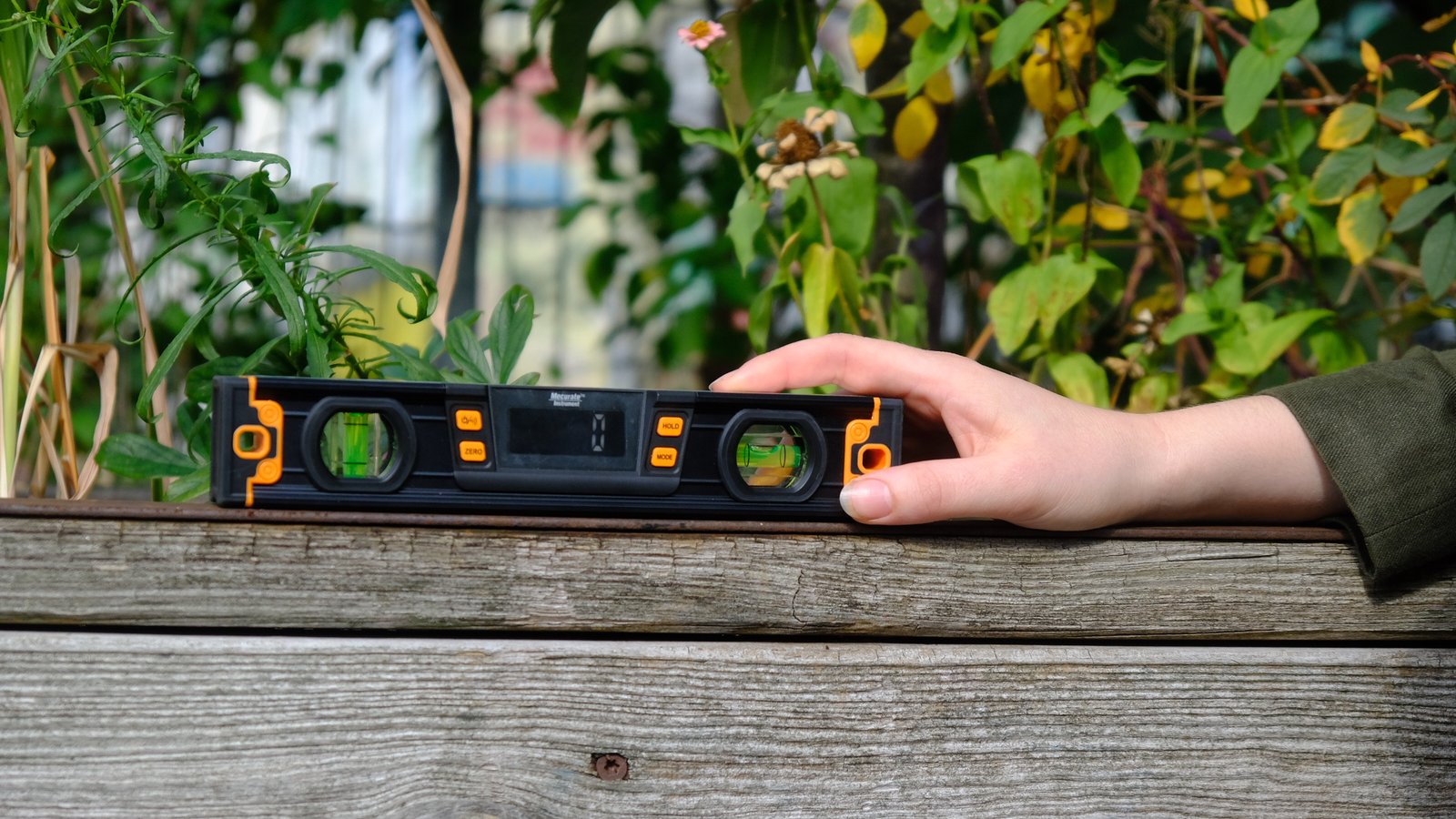 Digital spirit level on weathered timber